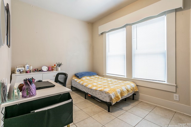 tiled bedroom with multiple windows