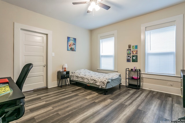 bedroom featuring ceiling fan and dark hardwood / wood-style flooring