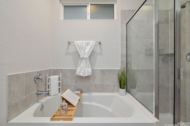 bathroom with independent shower and bath