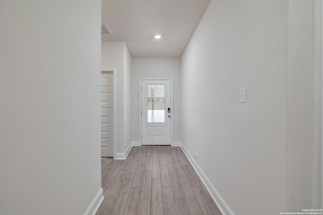 doorway to outside with light hardwood / wood-style floors