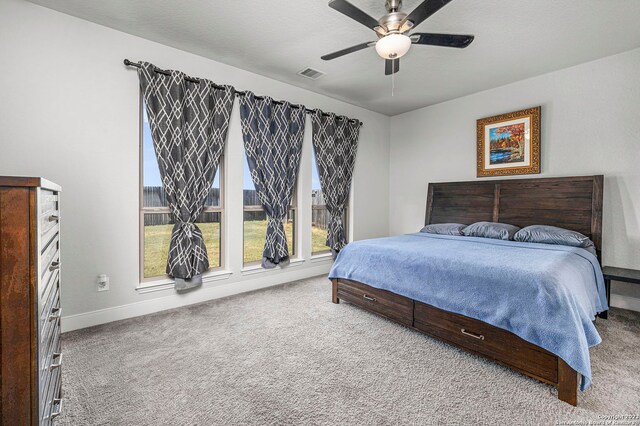 carpeted bedroom with ceiling fan