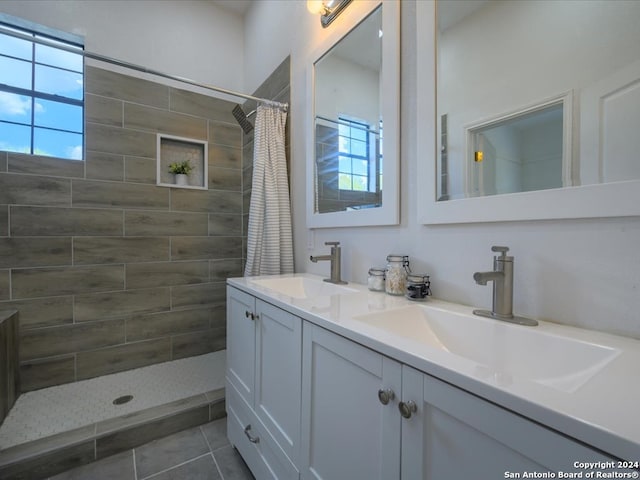 bathroom featuring a shower with curtain, vanity, plenty of natural light, and tile patterned flooring