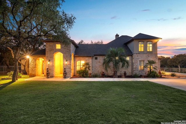 view of front of home with a yard