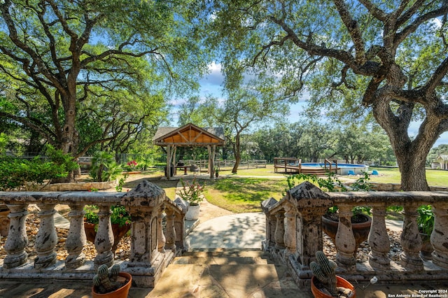 view of community with a gazebo and a swimming pool