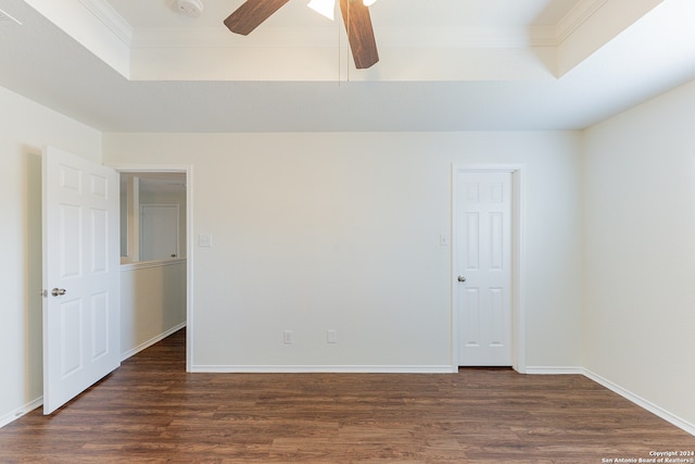 spare room with ceiling fan, dark hardwood / wood-style floors, and ornamental molding