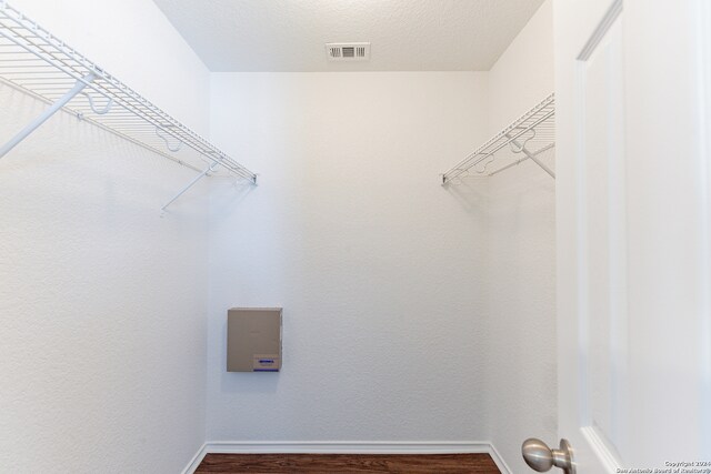 walk in closet featuring hardwood / wood-style flooring