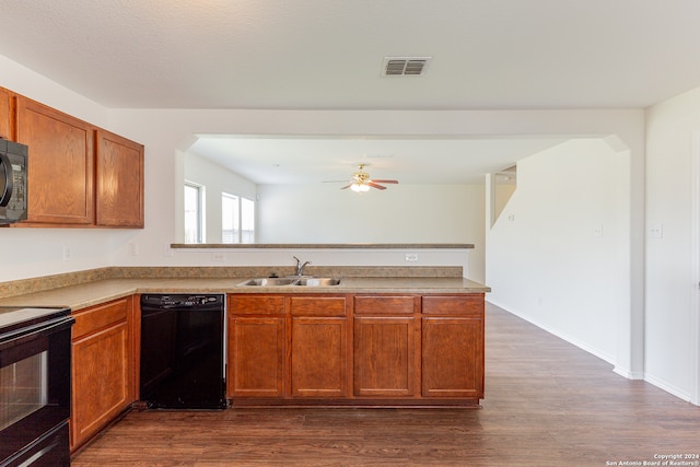 kitchen featuring ceiling fan, dark hardwood / wood-style floors, sink, and black appliances