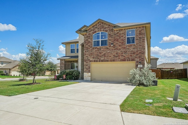 view of front property featuring a garage and a front lawn