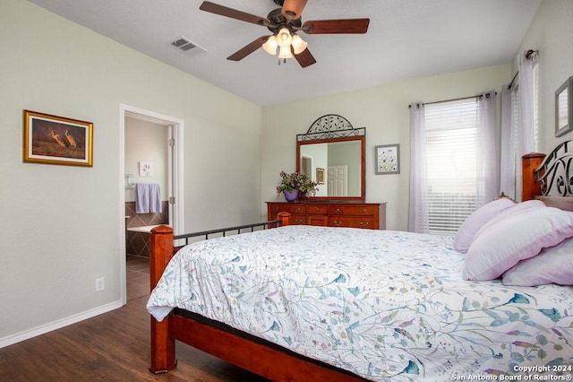 bedroom featuring a ceiling fan, dark wood finished floors, visible vents, and baseboards