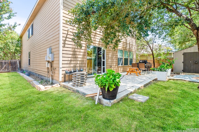 exterior space with a shed and a patio