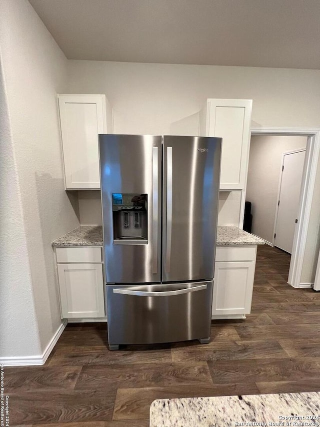 kitchen with white cabinetry, dark hardwood / wood-style floors, and stainless steel fridge with ice dispenser