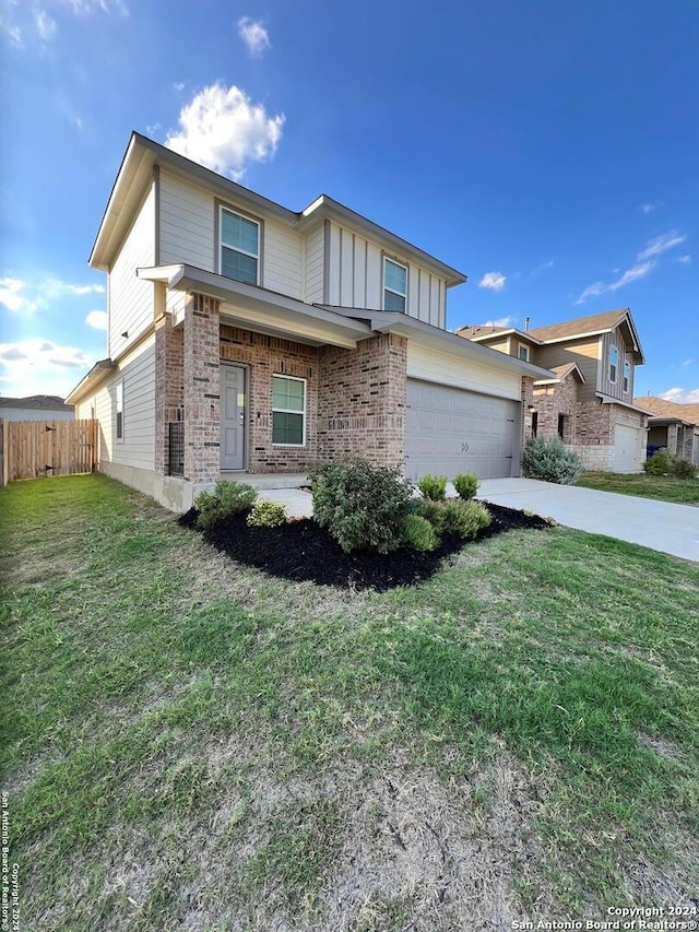 view of front facade featuring a garage and a front lawn