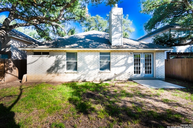 rear view of house with french doors and a patio