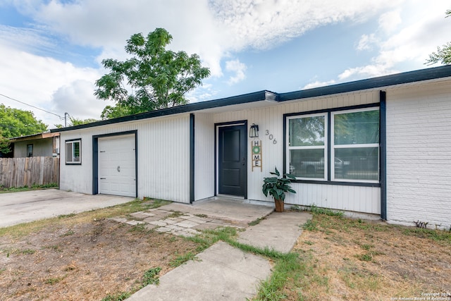 single story home with a garage