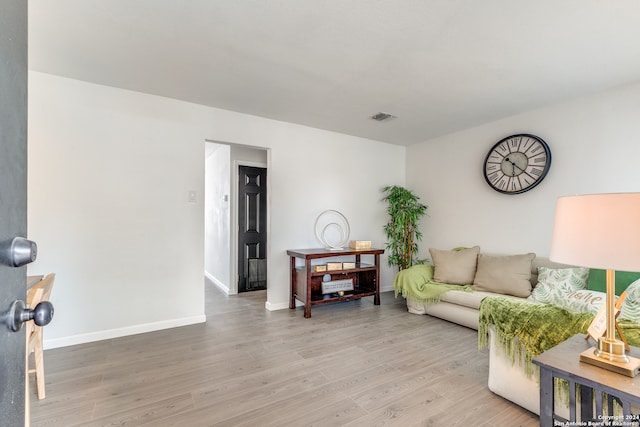 living room with light hardwood / wood-style floors