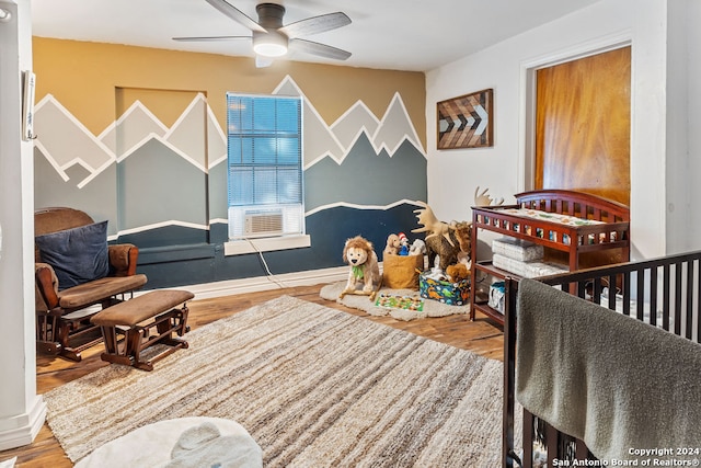 interior space with ceiling fan and hardwood / wood-style floors