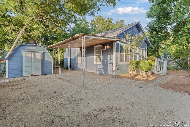 view of front of house with a storage unit