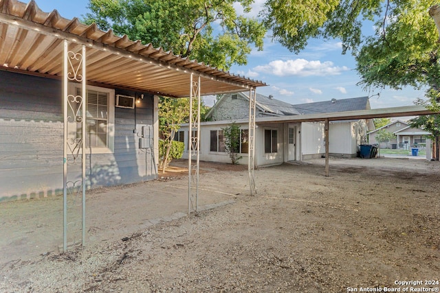 back of house with an outdoor structure