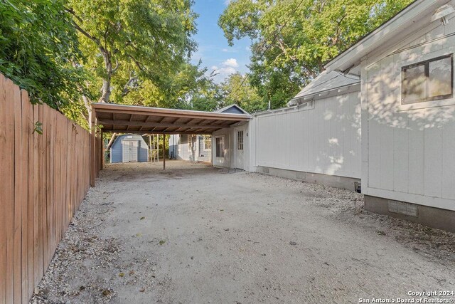 exterior space with a storage shed