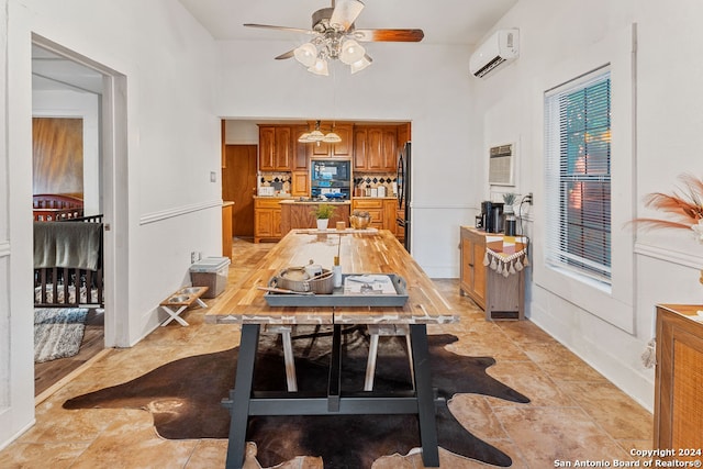 dining area with a wall mounted AC and ceiling fan