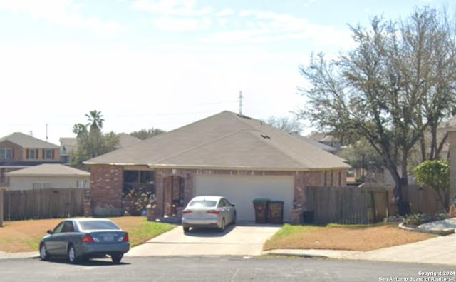 ranch-style home featuring a garage