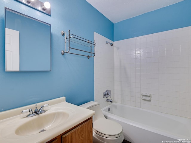 full bathroom featuring vanity, toilet, and tiled shower / bath