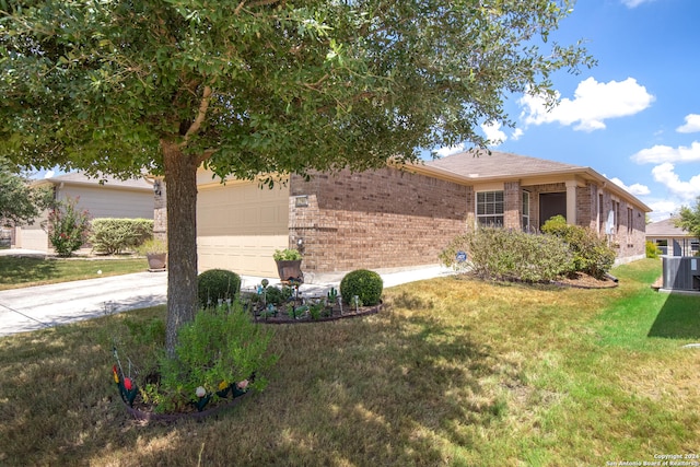 view of front of property featuring a garage, a front yard, and cooling unit