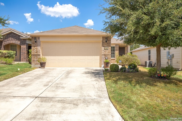 ranch-style house with central AC, a front yard, and a garage