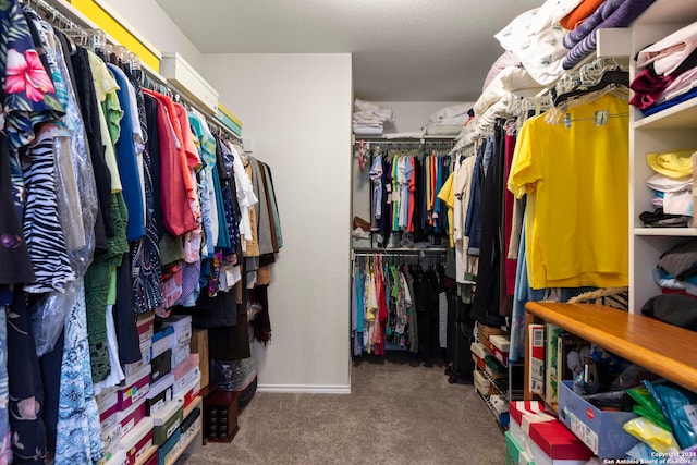 spacious closet featuring dark carpet