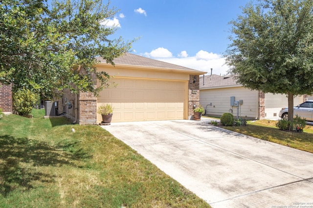 view of front of home with a front yard, driveway, and an attached garage