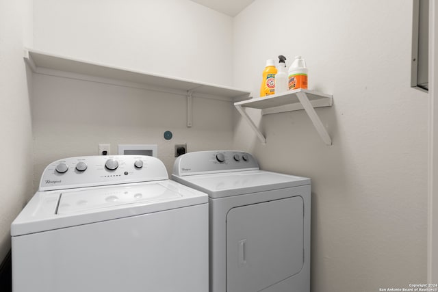 clothes washing area featuring independent washer and dryer