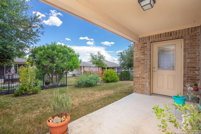 view of yard featuring a patio area and fence