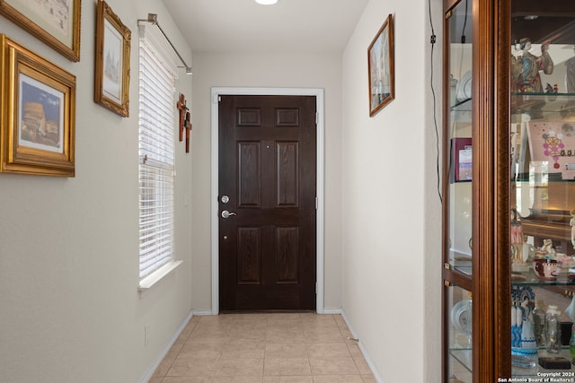 doorway featuring light tile patterned floors