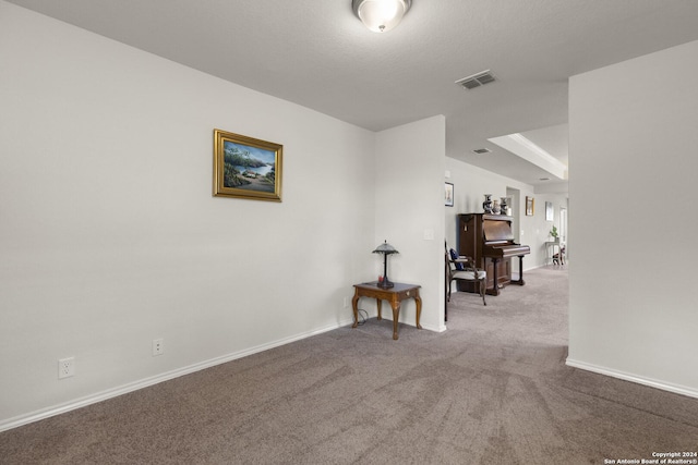 carpeted empty room with baseboards and visible vents