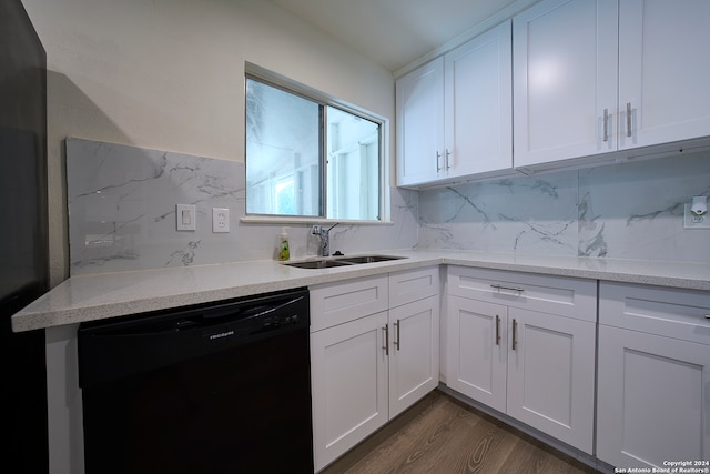 kitchen featuring white cabinets, dishwasher, sink, dark hardwood / wood-style floors, and decorative backsplash