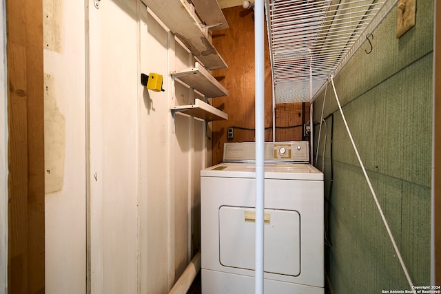 clothes washing area with separate washer and dryer