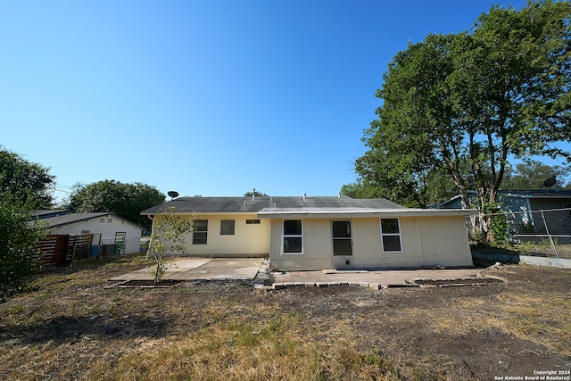 rear view of property featuring a patio area