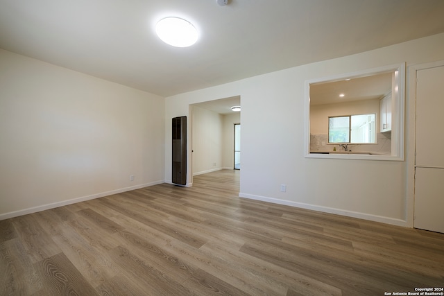 spare room featuring hardwood / wood-style floors