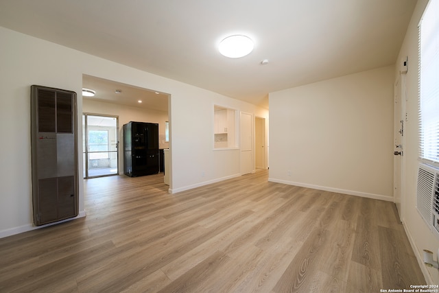 empty room with hardwood / wood-style floors