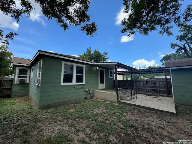 view of front of home with a patio, crawl space, cooling unit, and fence