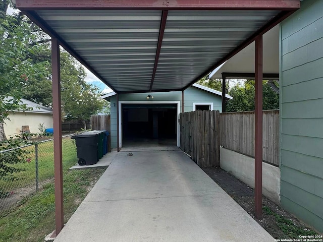 view of parking with fence