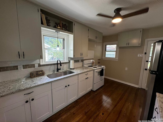 kitchen with dark hardwood / wood-style flooring, sink, white electric range, stainless steel fridge, and ceiling fan