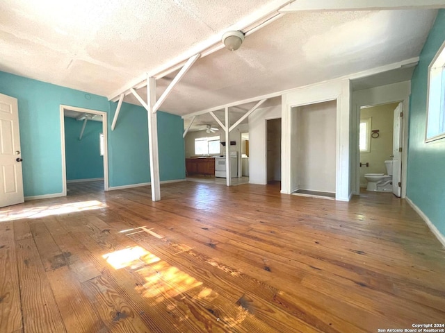 interior space with wood-type flooring, a textured ceiling, and ceiling fan