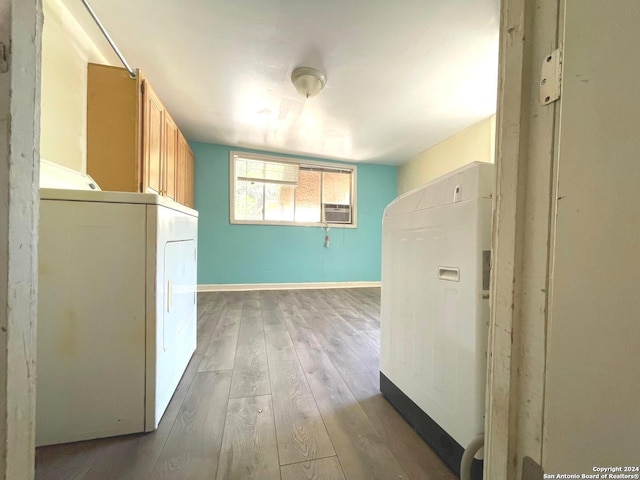 hallway featuring washer / dryer, cooling unit, and dark hardwood / wood-style floors