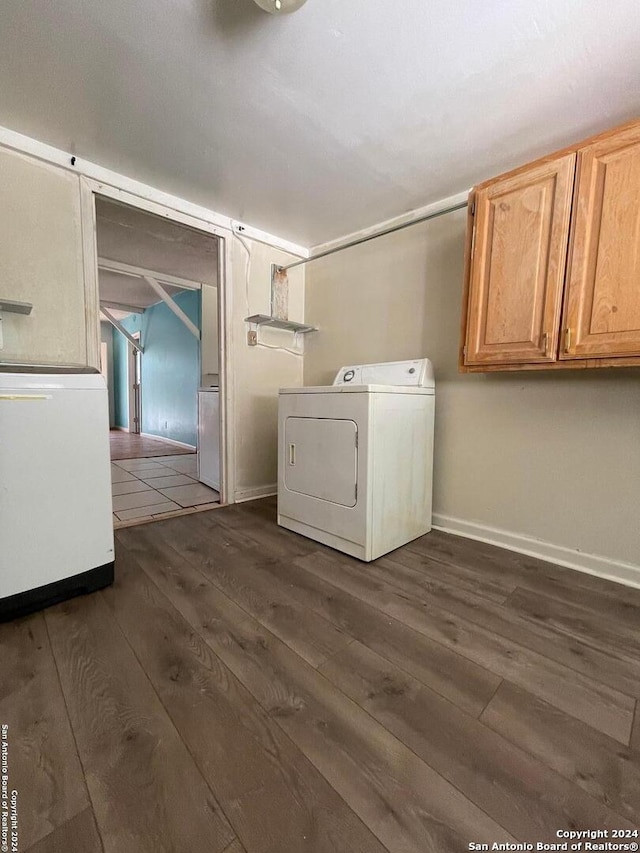 laundry room featuring washer / dryer and dark hardwood / wood-style floors