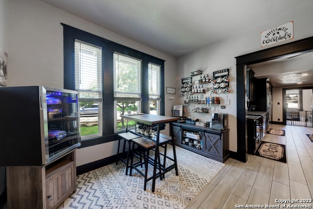 office with light wood-type flooring