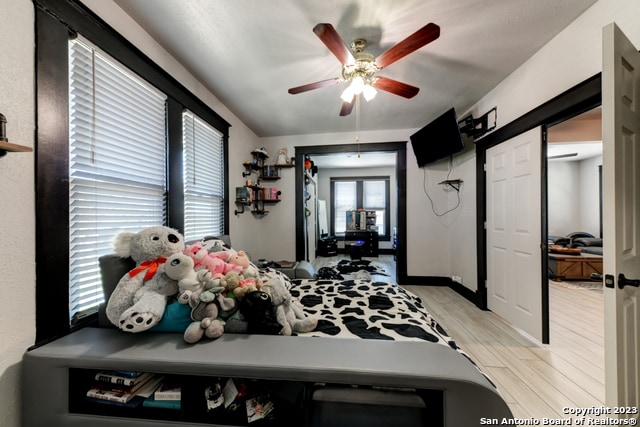 bedroom featuring light wood-type flooring and ceiling fan