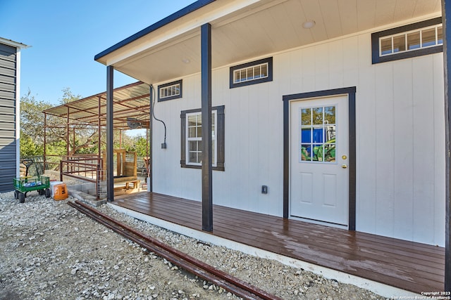 entrance to property featuring a deck