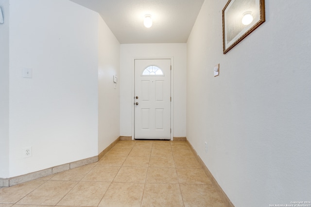 entryway featuring light tile patterned floors