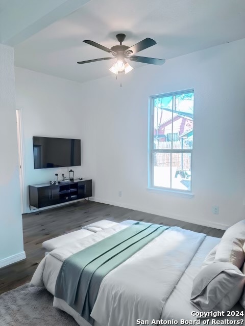 bedroom with ceiling fan and dark hardwood / wood-style floors